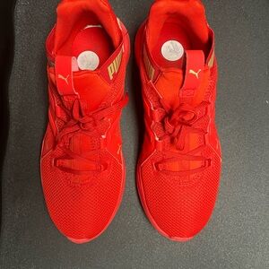 Puma Bold Red Sneakers with Gold Highlights